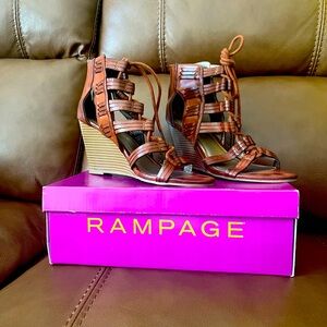 Women’s Rampage Wedge Sandals
Size: 9M
Cognac